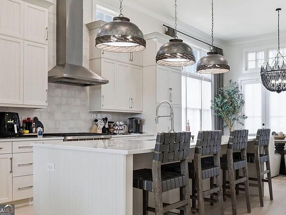 Wolf range, custom kitchen cabinetry and island